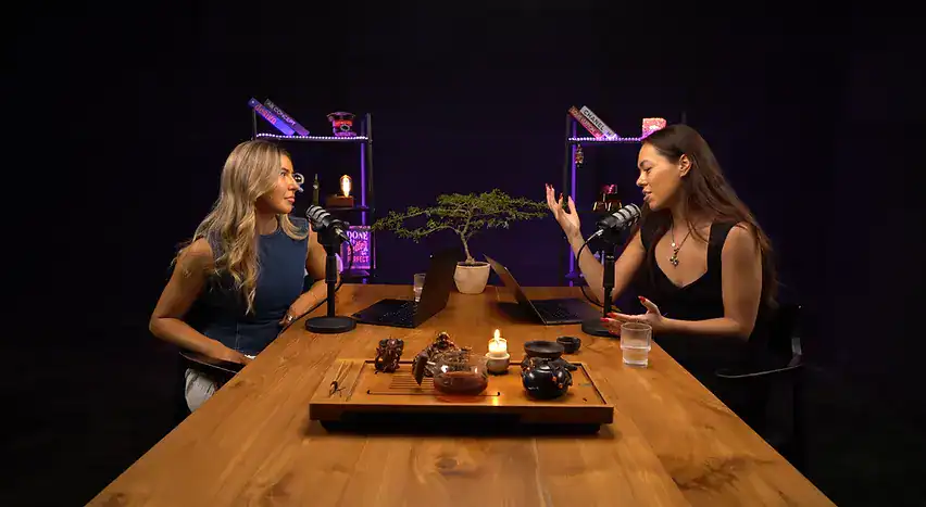 1. Contemporary podcast studio setup with two women recording conversations in a stylish environment.