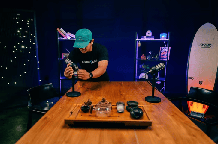 Premium podcast recording studio setup with professional microphones and camera equipment.