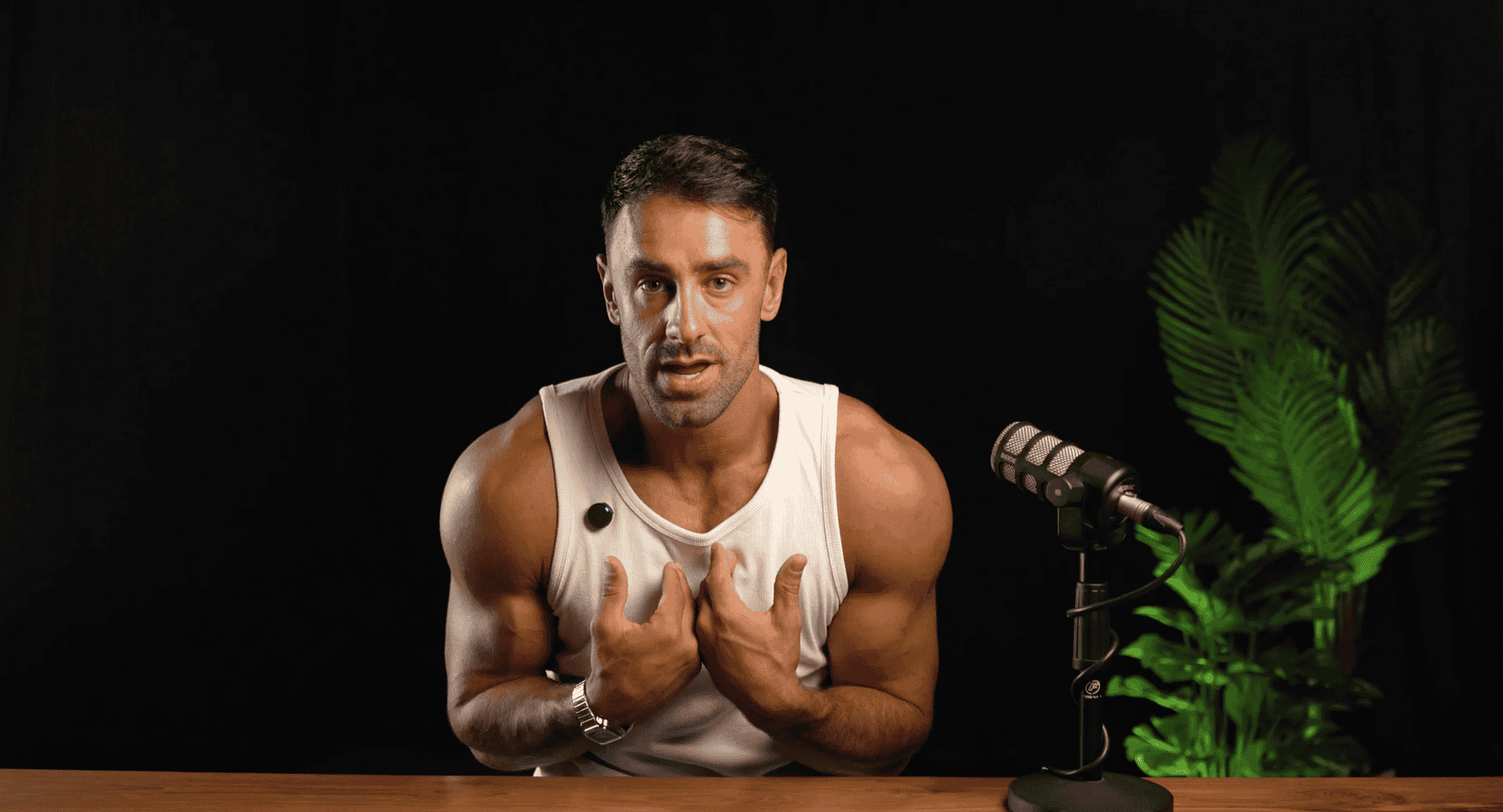 Villo Studio professional podcast or video recording setup with a dynamic speaker in front of black background.